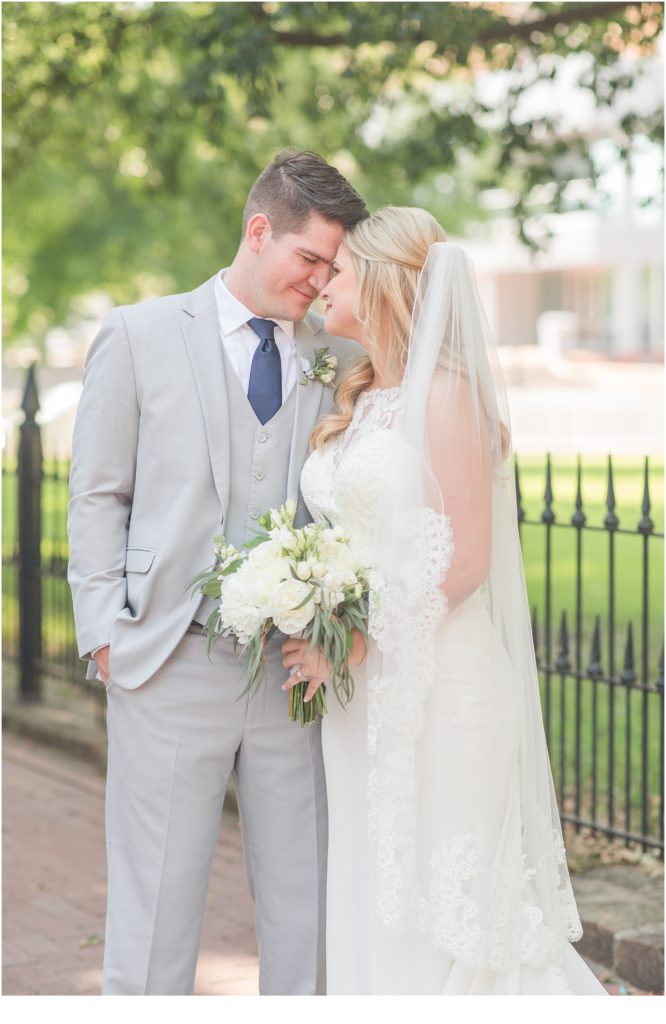 a man and a woman in love wedding day in gray suit and white wedding dress