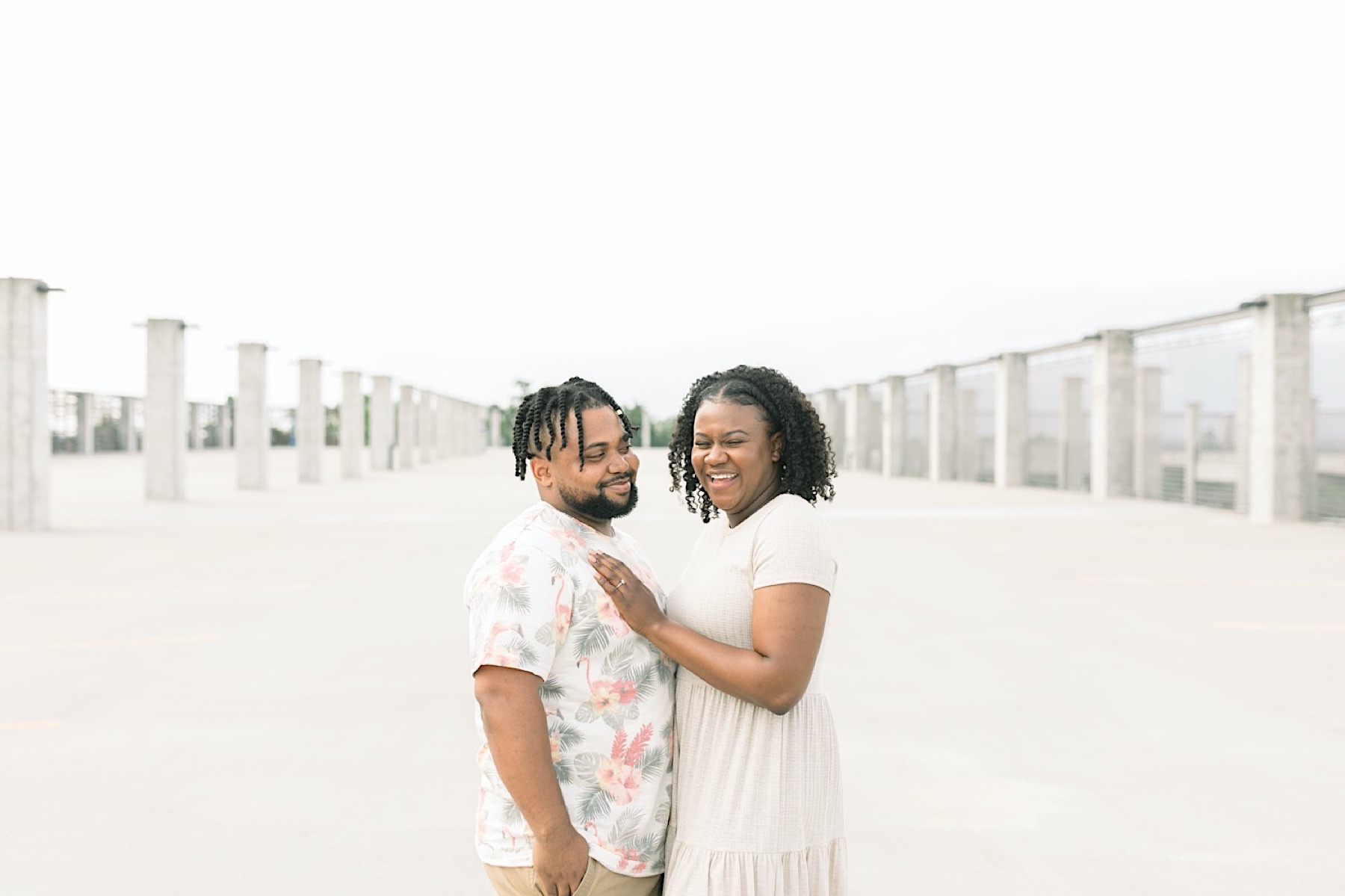 man and woman walking with each other during their fayetteville arkansas engagement session