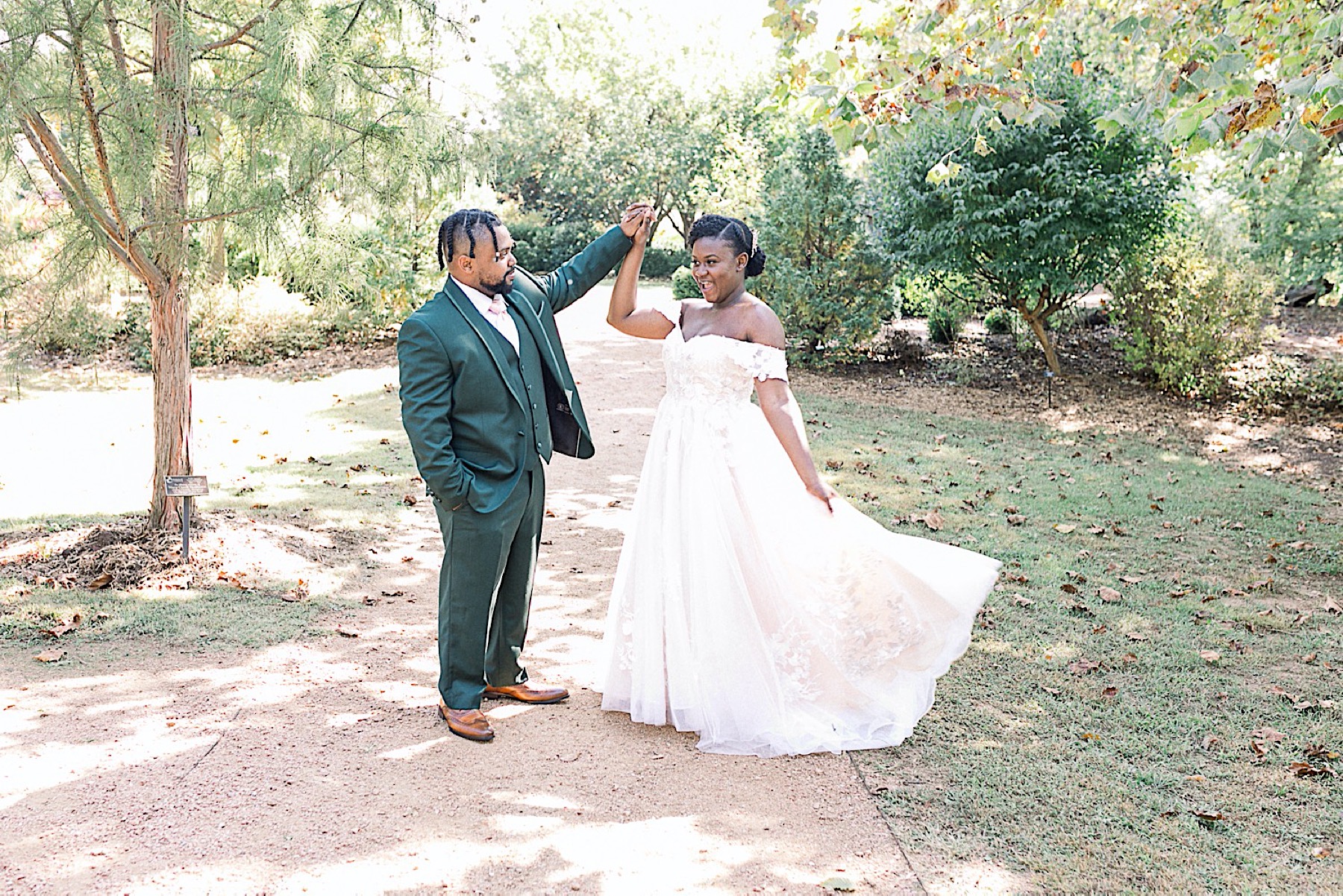 bride and groom dancing with each other at the Botanical Gardens of the Ozarks in Fayetteville arkansas Fayetteville/Northwest Arkansas Wedding Photographer