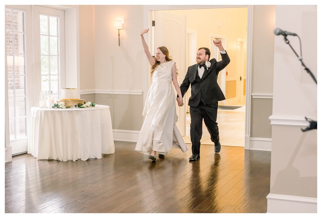 bride and groom walking into reception during wedding at Windsor at Hebron Park in Carrollton Dallas, Texas