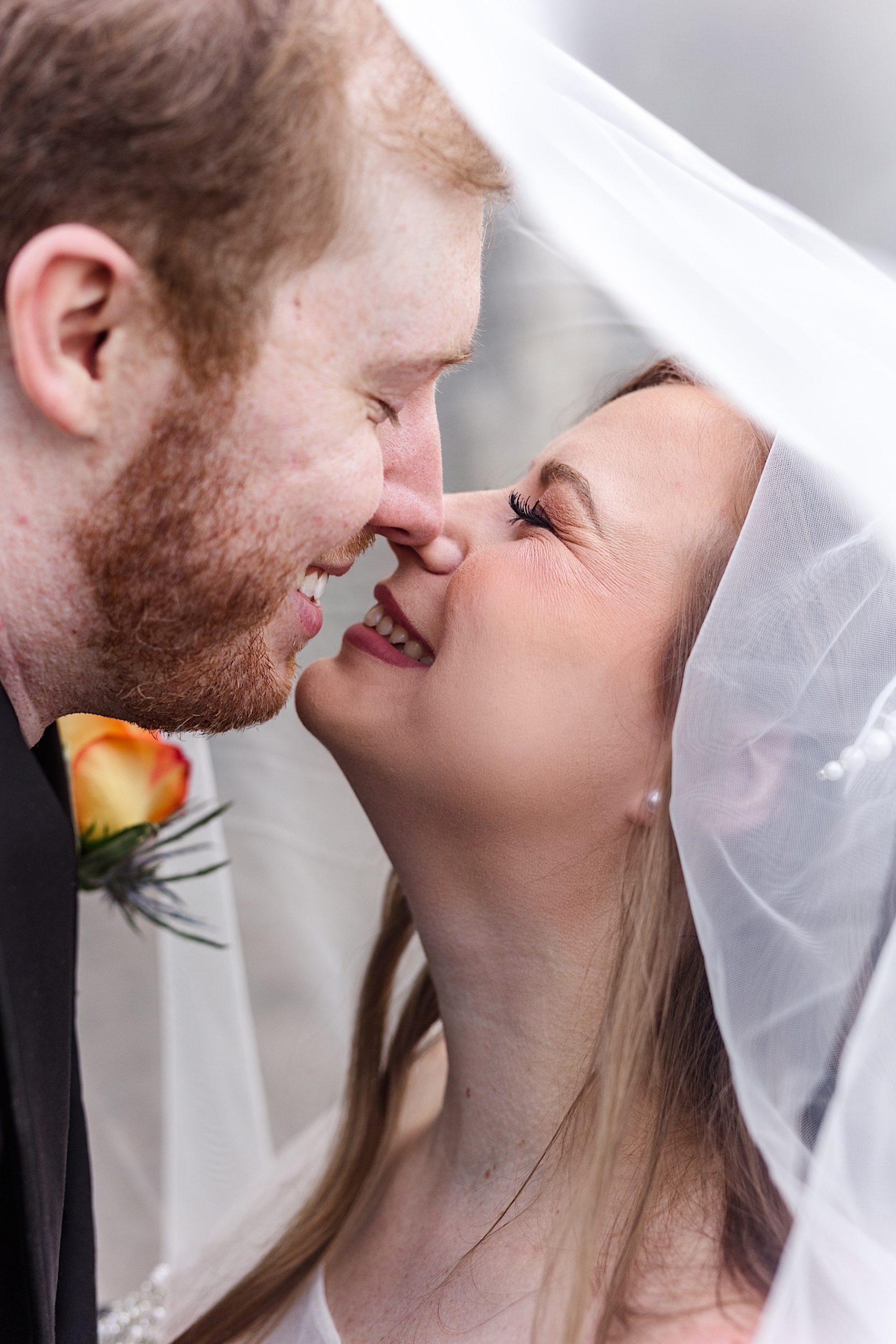 bride and groom touching noses during their Bo Adams Estate Wedding in Northeast Arkansas